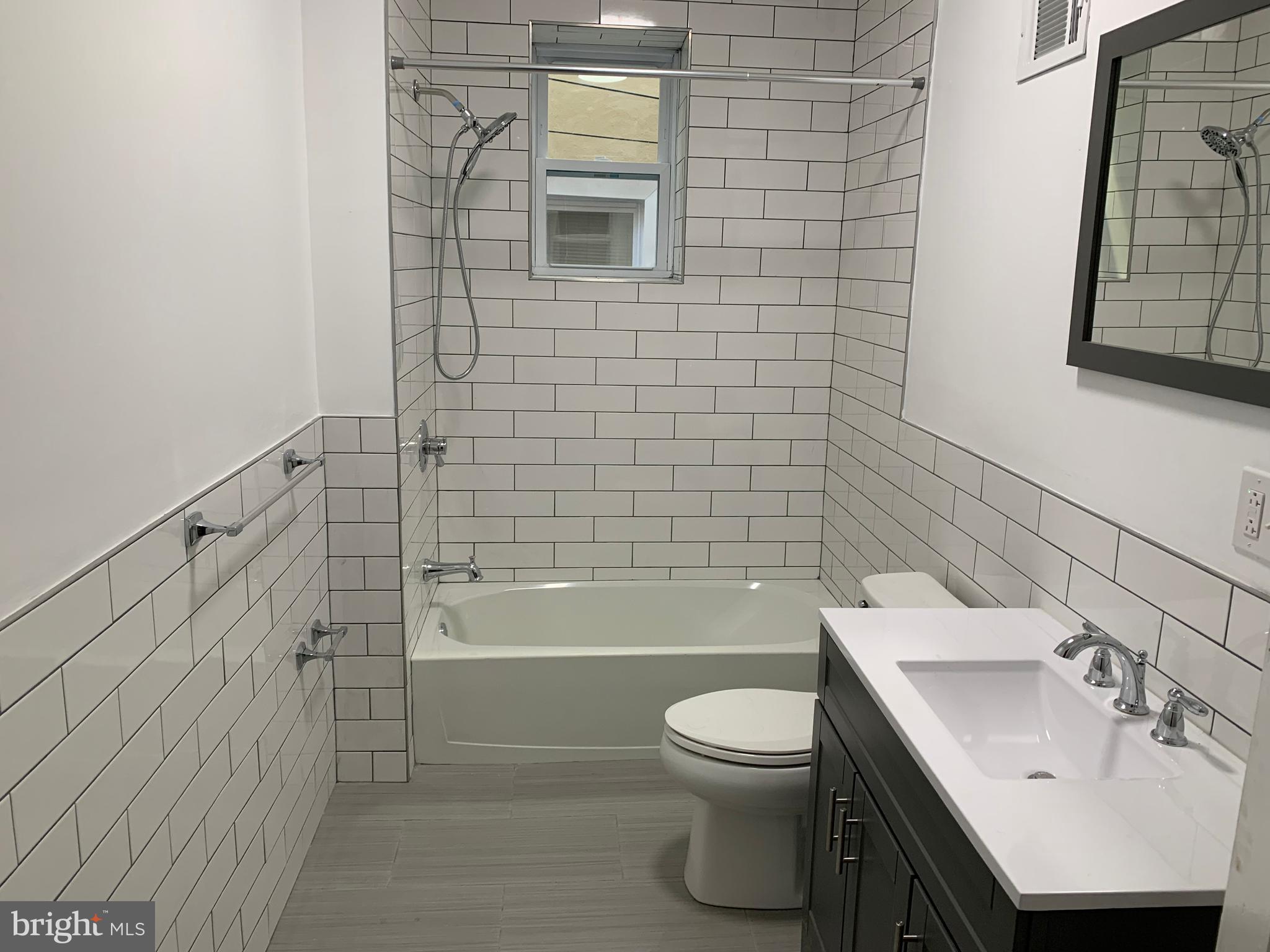 5435 Angora Terrace Philadelphia, PA 19143 - Photo 7 of 7 a bathroom with a sink toilet and shower