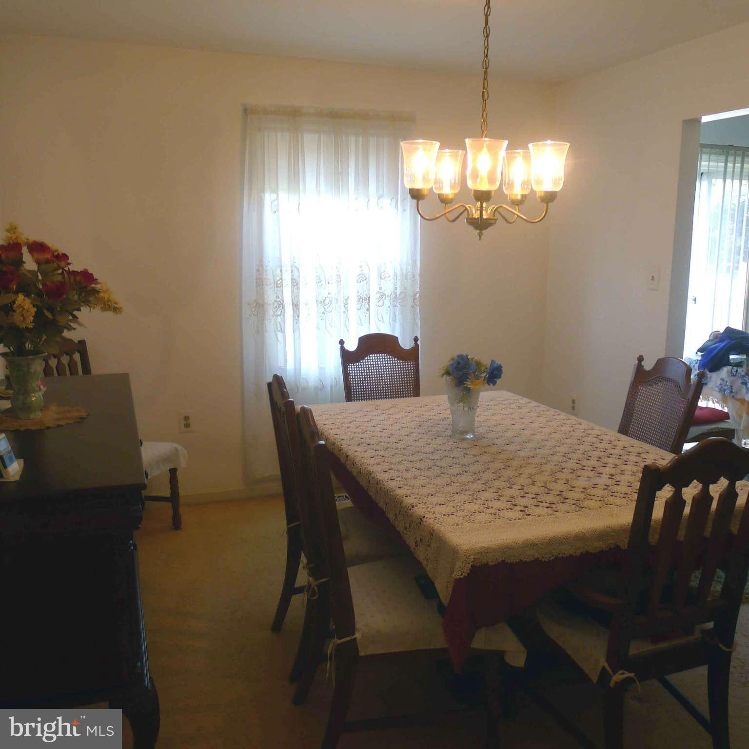 14430 Bakersfield Court Silver Spring, MD 20906 - Photo 2 of 7 a dining room with furniture and window