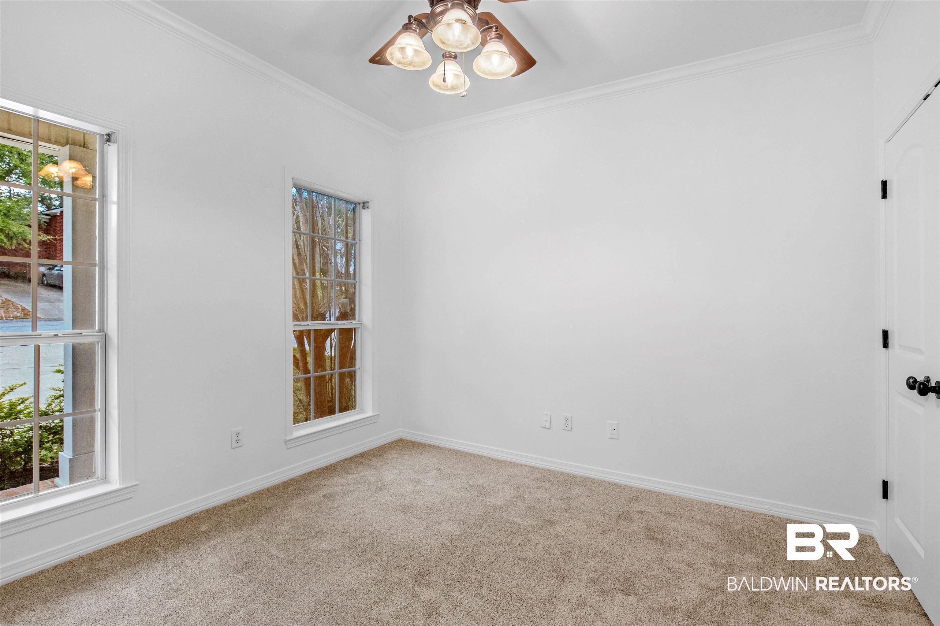 1007 Linlen Avenue Mobile, AL 36609 - Photo 10 of 21 Carpeted spare room with crown molding