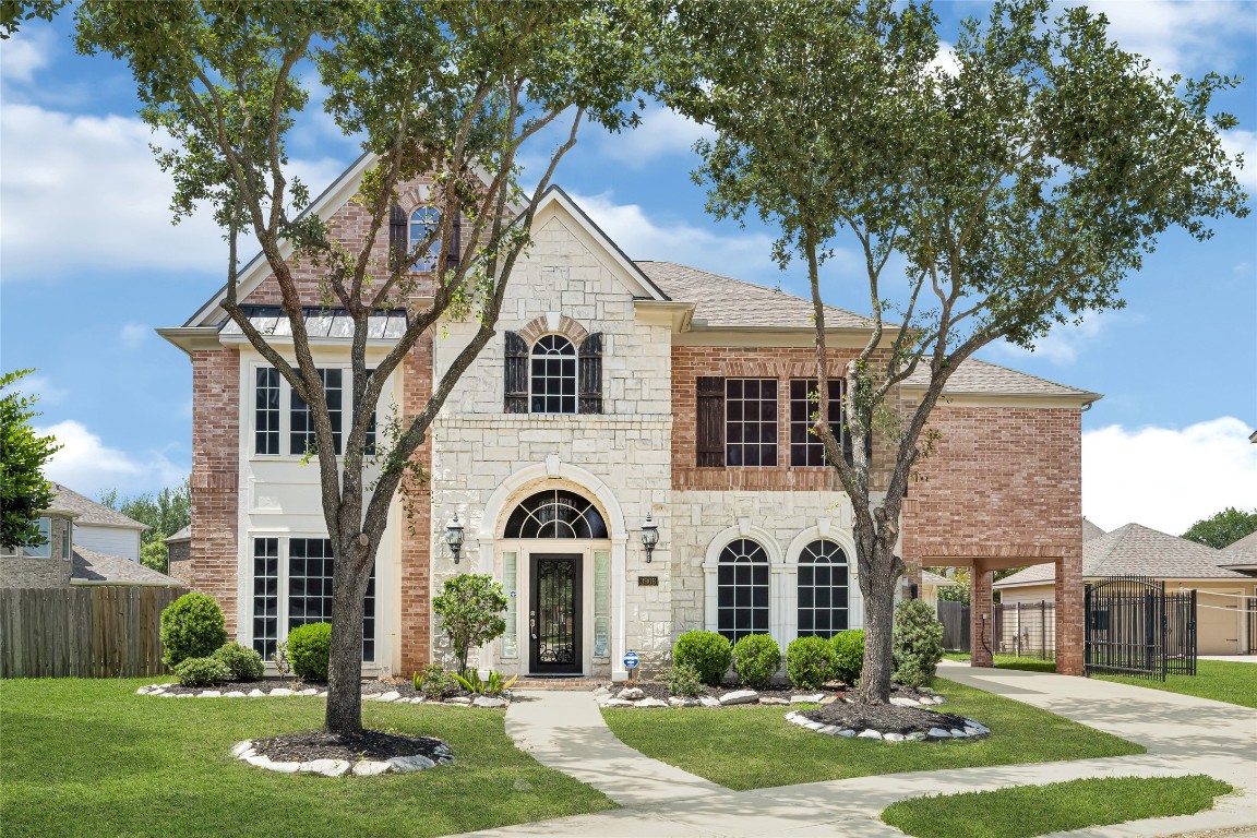 3906 Point Cuero Court Katy, TX 77494 - Photo 1 of 40 a front view of a house with a yard and garage