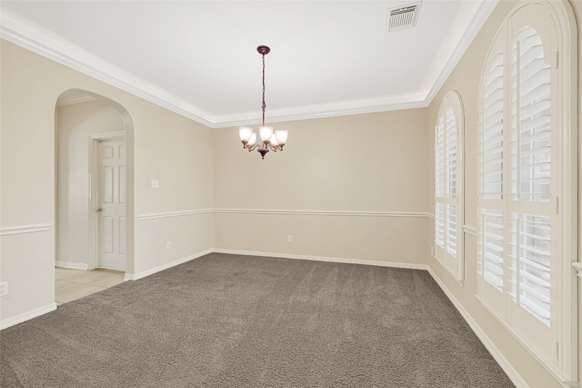 3906 Point Cuero Court Katy, TX 77494 - Photo 13 of 40 a view of a room with a window and chandelier fan