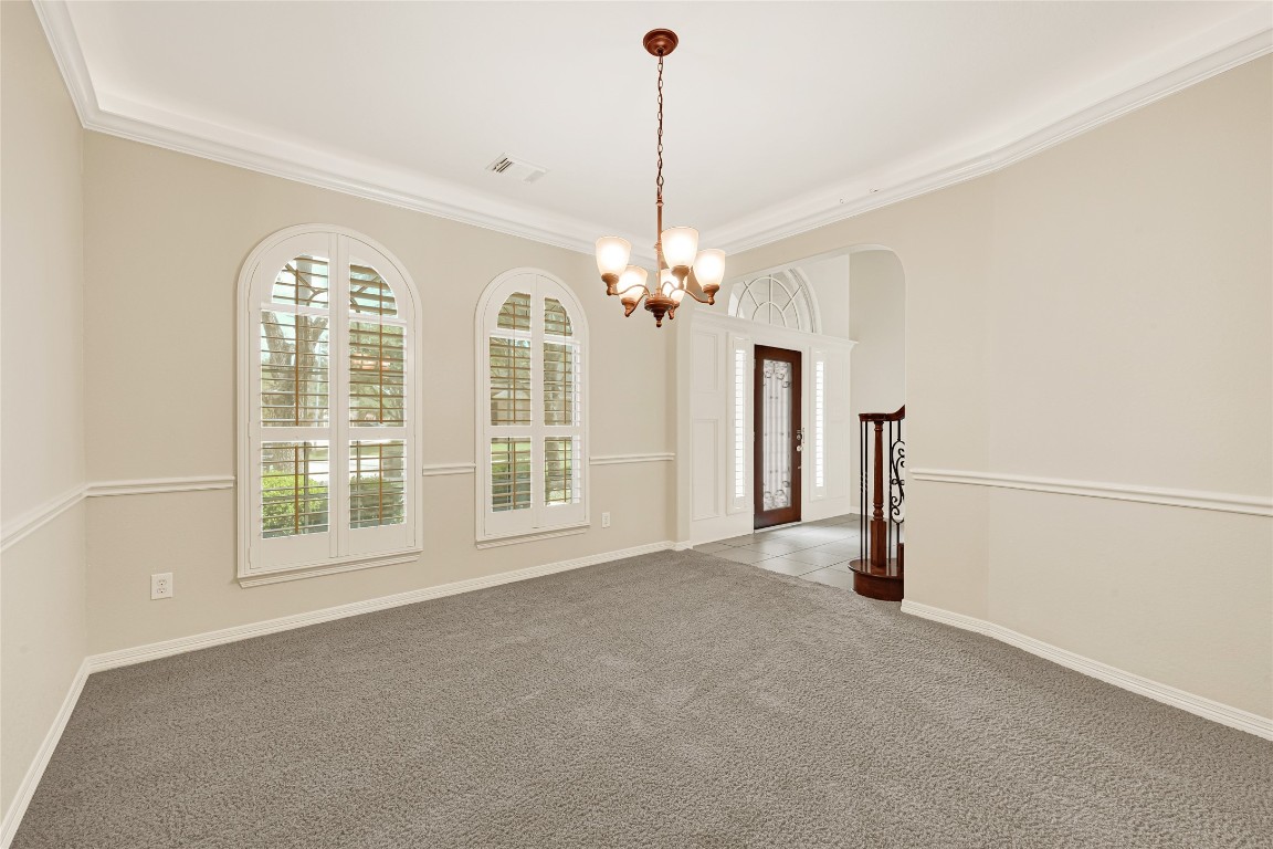 3906 Point Cuero Court Katy, TX 77494 - Photo 14 of 40 a view of a room with windows and chandelier