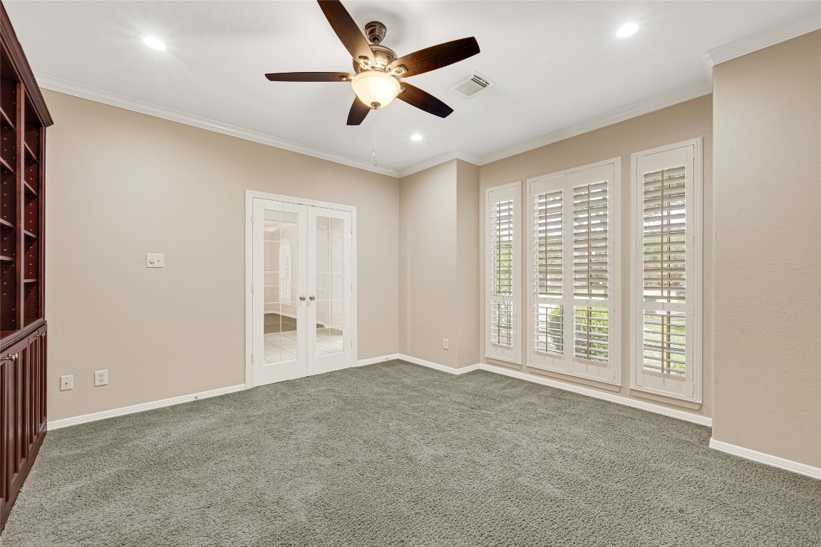 3906 Point Cuero Court Katy, TX 77494 - Photo 17 of 40 an empty room with windows and ceiling fan
