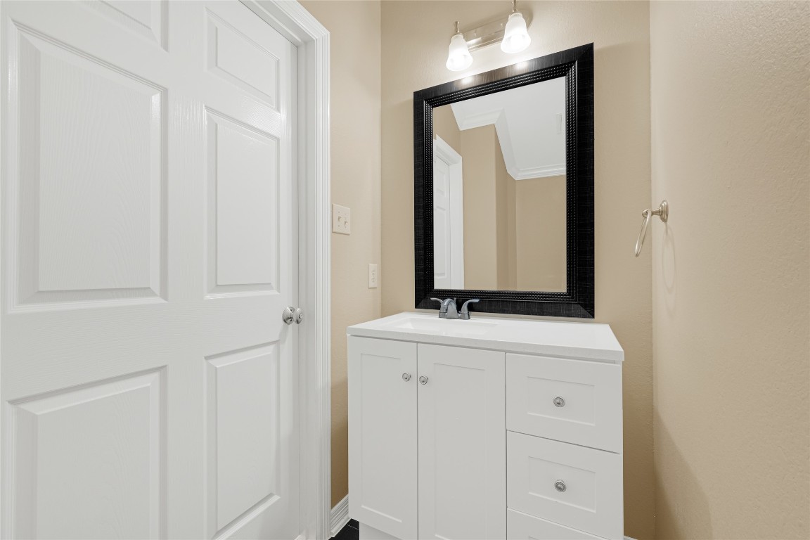 3906 Point Cuero Court Katy, TX 77494 - Photo 18 of 40 a bathroom with a granite countertop sink and a mirror