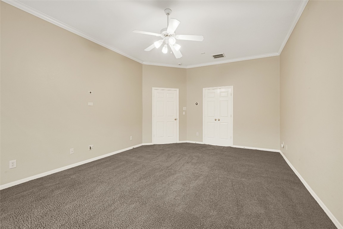 3906 Point Cuero Court Katy, TX 77494 - Photo 20 of 40 a view of an empty room with a ceiling fan
