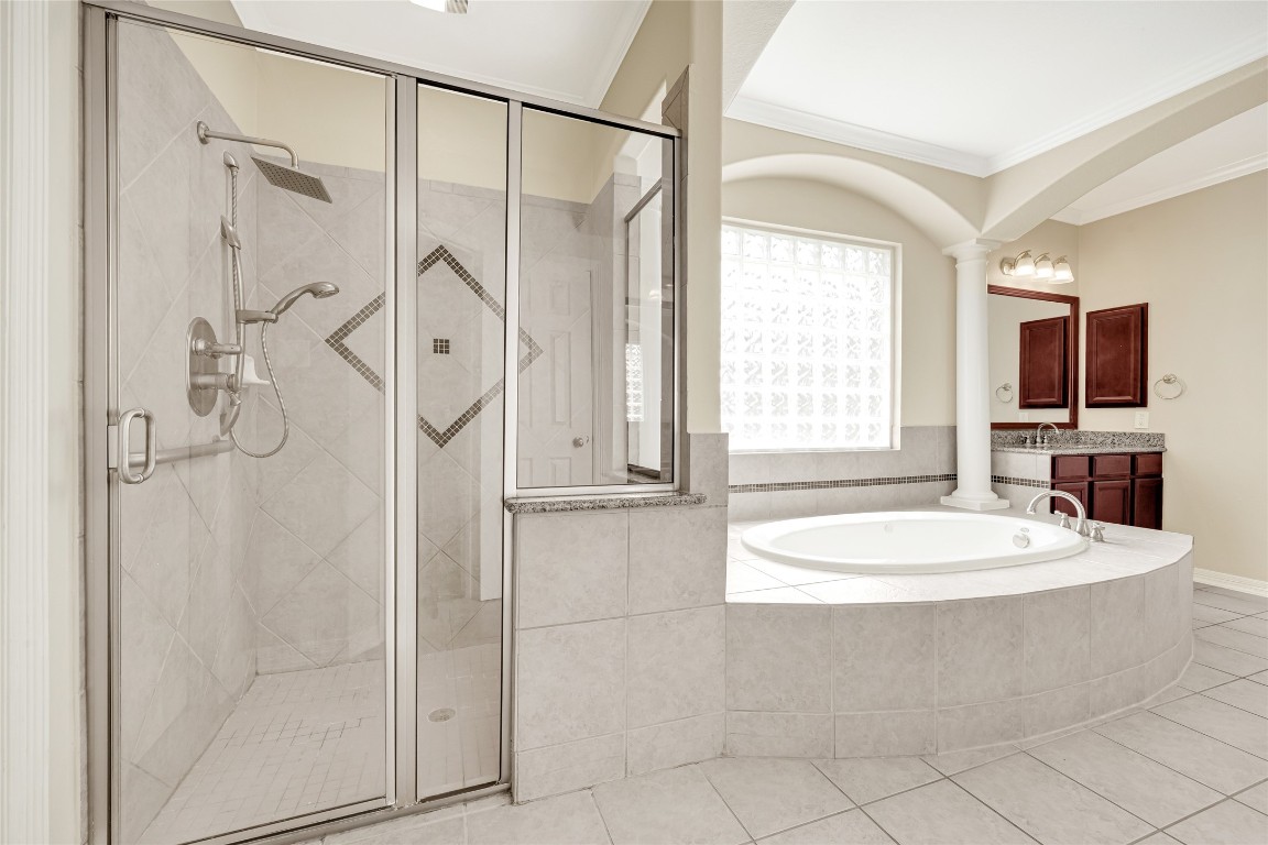 3906 Point Cuero Court Katy, TX 77494 - Photo 23 of 40 a bathroom with a sink a mirror and a shower