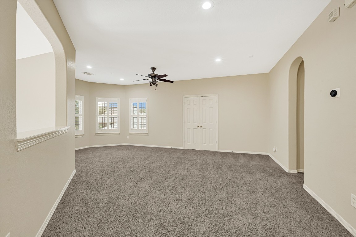 3906 Point Cuero Court Katy, TX 77494 - Photo 26 of 40 an empty room with windows and cabinet