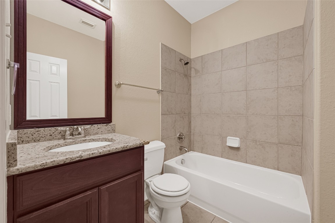 3906 Point Cuero Court Katy, TX 77494 - Photo 28 of 40 a bathroom with a sink a toilet and a mirror