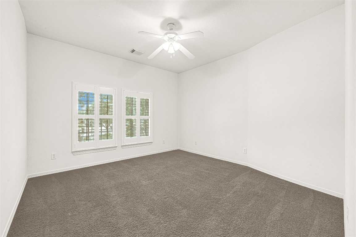 3906 Point Cuero Court Katy, TX 77494 - Photo 29 of 40 an empty room with windows and fan