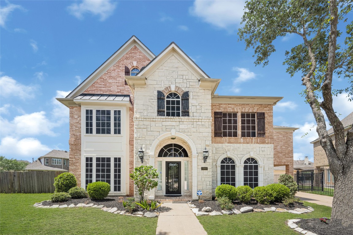 3906 Point Cuero Court Katy, TX 77494 - Photo 3 of 40 a front view of a house with garden