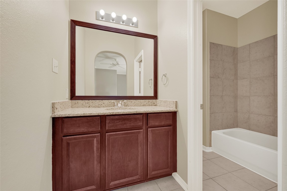 3906 Point Cuero Court Katy, TX 77494 - Photo 31 of 40 a bathroom with a sink a mirror and a bathtub