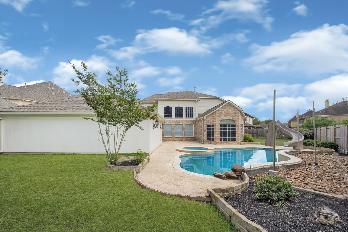 3906 Point Cuero Court Katy, TX 77494 - Photo 39 of 40 a front view of a house with garden