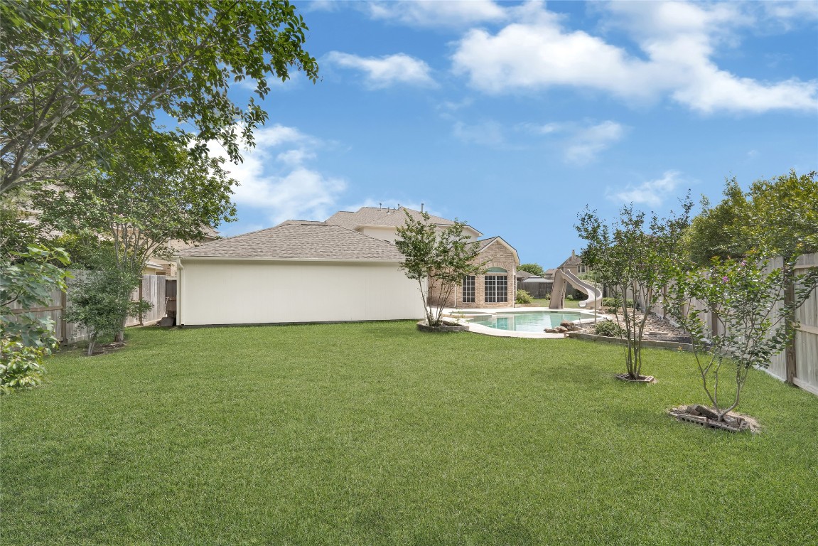 3906 Point Cuero Court Katy, TX 77494 - Photo 40 of 40 a view of a house with a big yard and a large tree