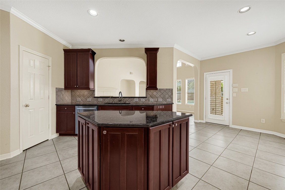 3906 Point Cuero Court Katy, TX 77494 - Photo 10 of 40 a kitchen with granite countertop a sink and cabinets