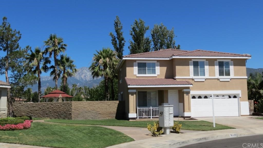 16593 Colonial Drive Fontana, CA 92336 - Photo 1 of 1 a front view of a house with garden
