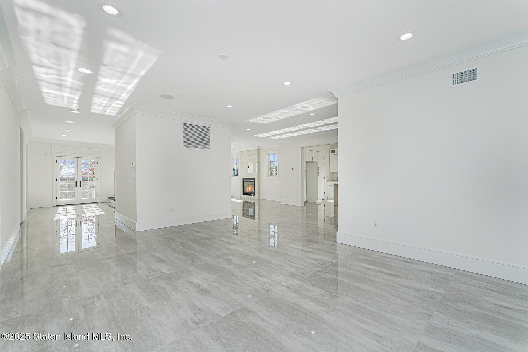 91 West Entry Road Staten Island, NY 10304 - Photo 13 of 57 a view of empty room with wooden floor