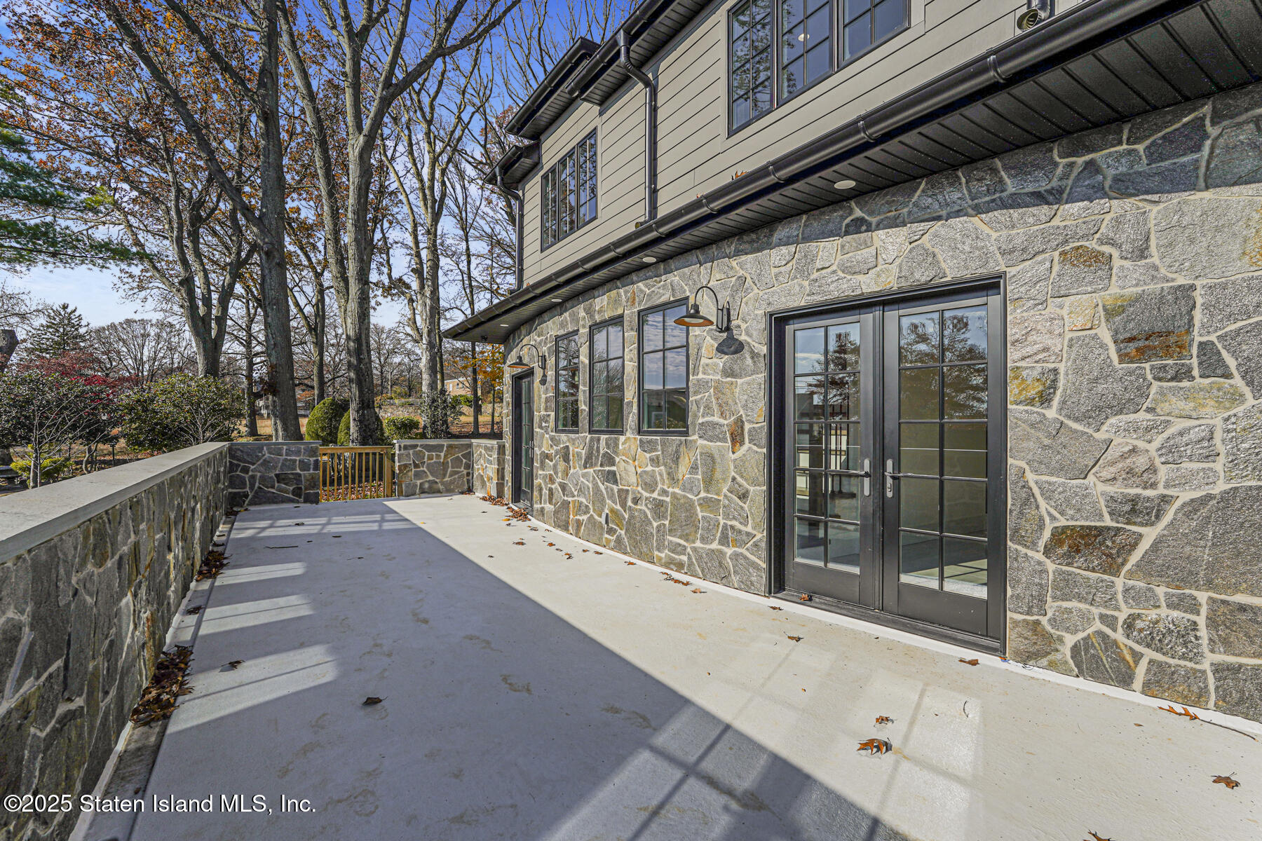 91 West Entry Road Staten Island, NY 10304 - Photo 18 of 57 a view of a brick house with a large window