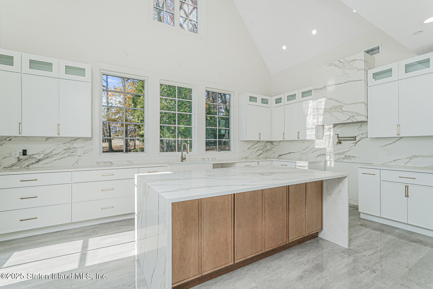 91 West Entry Road Staten Island, NY 10304 - Photo 25 of 57 a kitchen with granite countertop white cabinets and sink