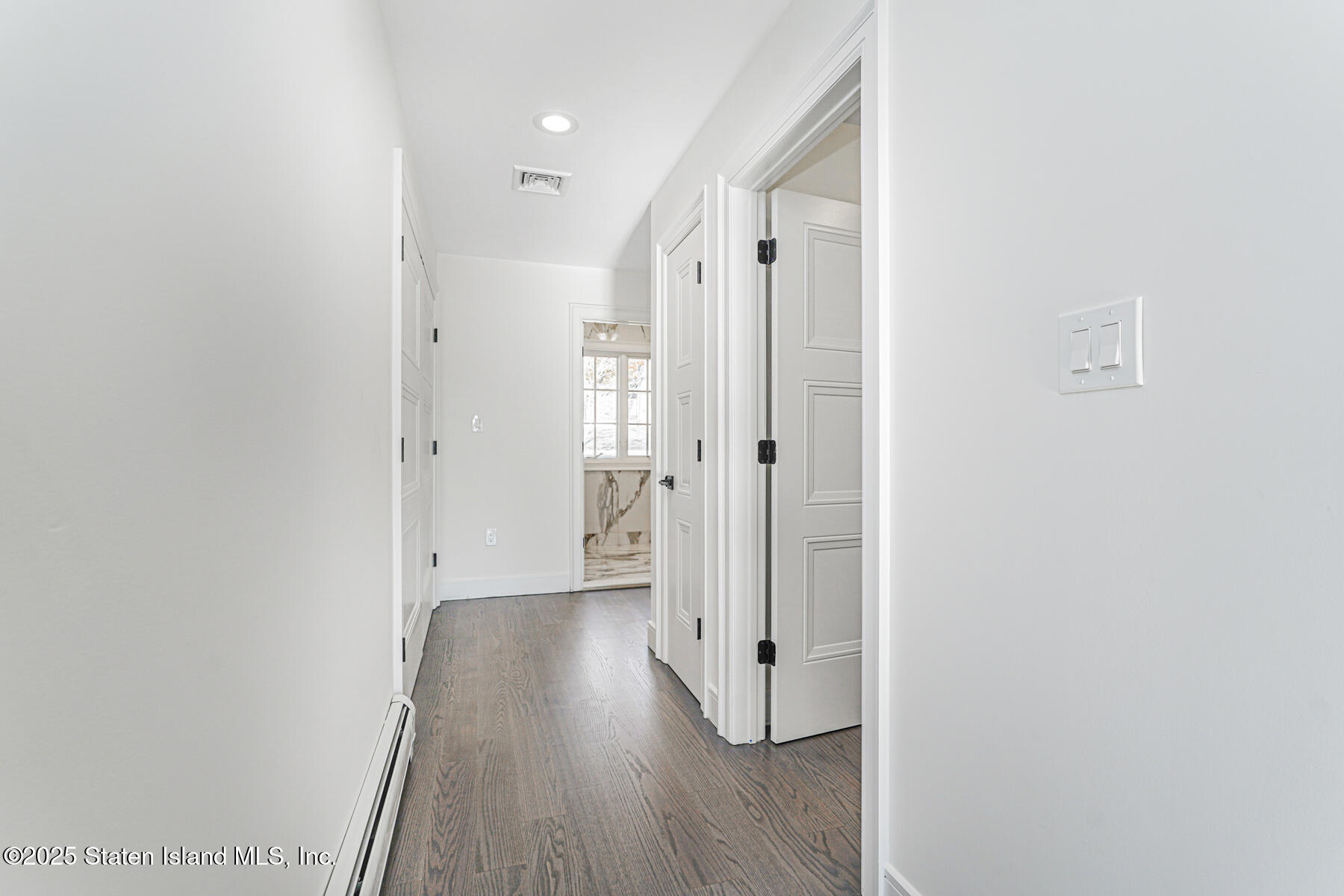 91 West Entry Road Staten Island, NY 10304 - Photo 34 of 57 a view of a hallway with wooden floor