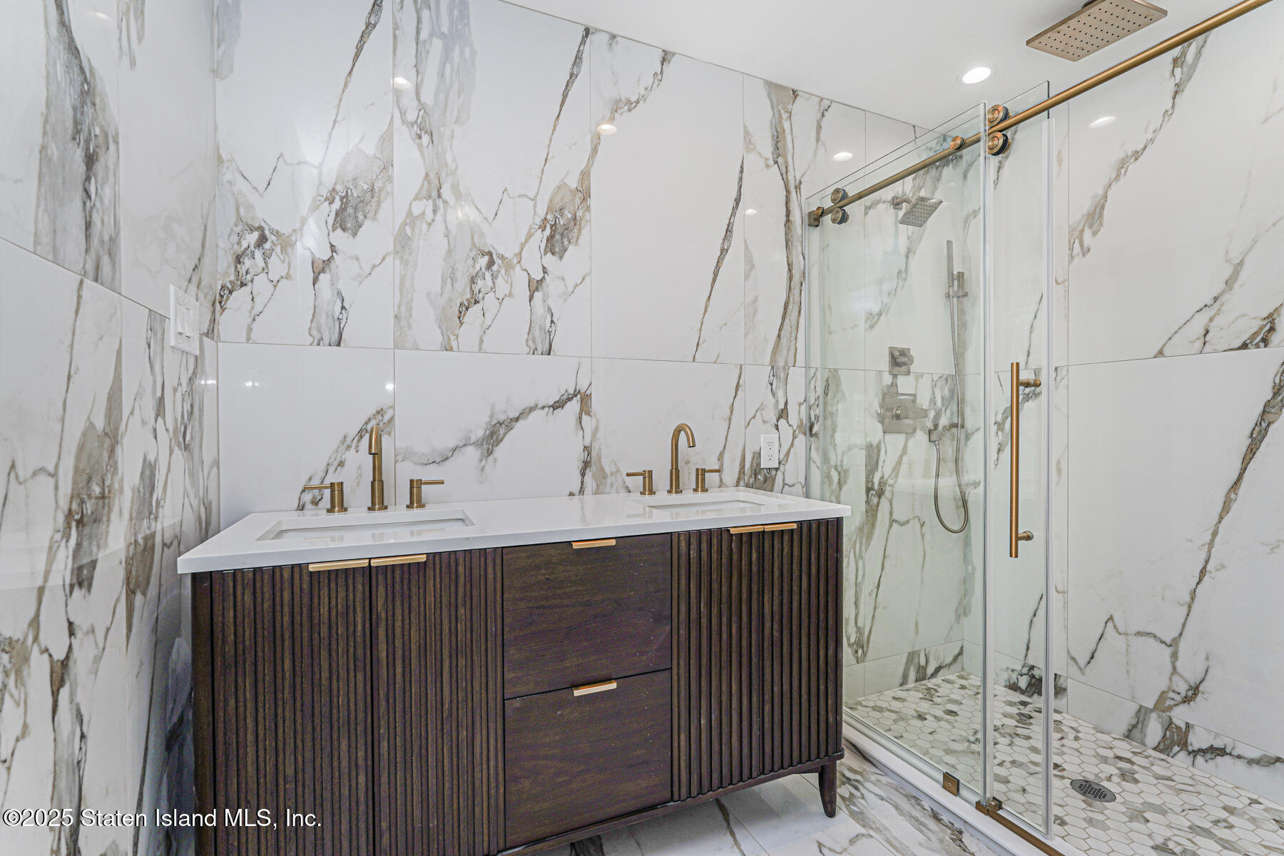 91 West Entry Road Staten Island, NY 10304 - Photo 38 of 57 a bathroom with a sink and mirror
