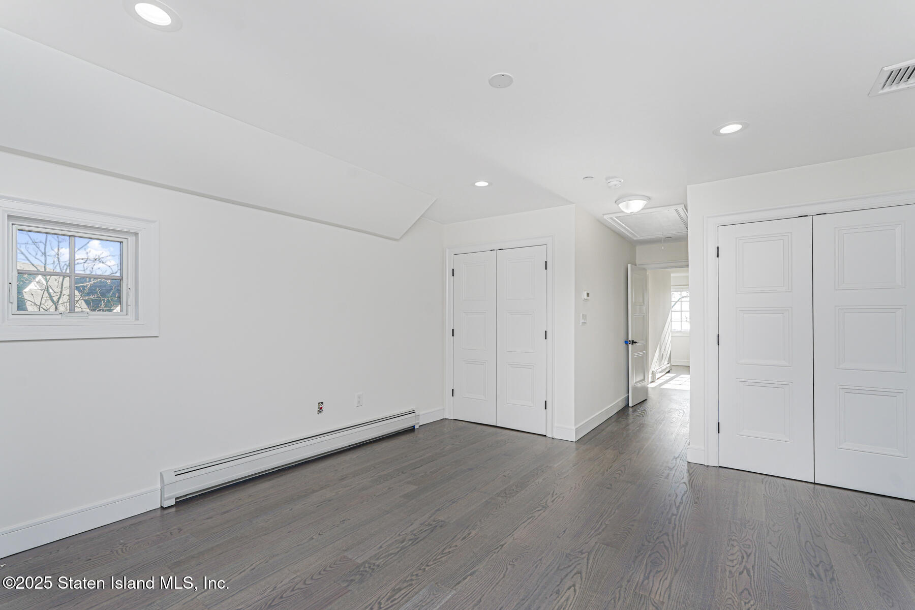 91 West Entry Road Staten Island, NY 10304 - Photo 41 of 57 an empty room with wooden floor