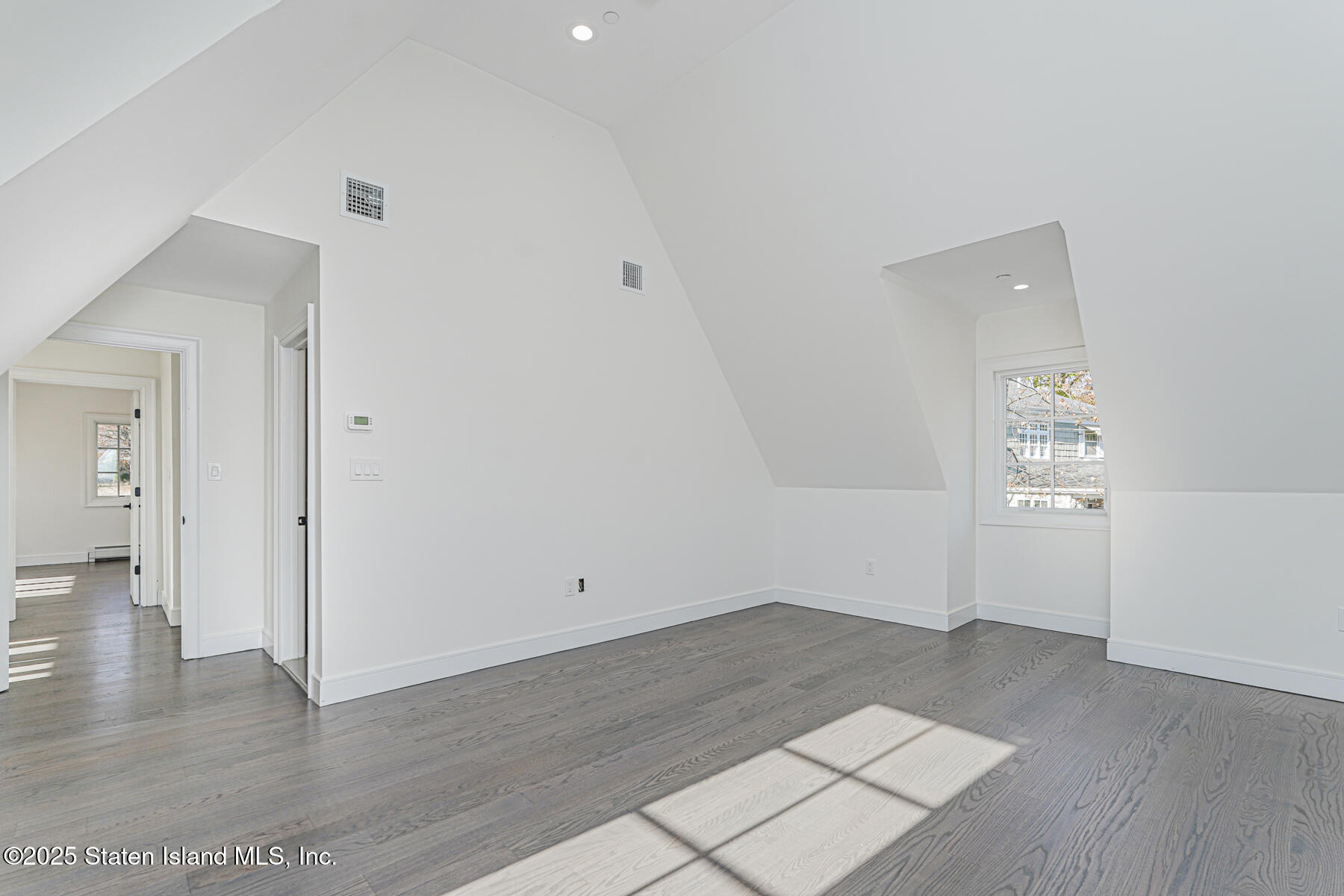 91 West Entry Road Staten Island, NY 10304 - Photo 45 of 57 wooden floor in an empty room