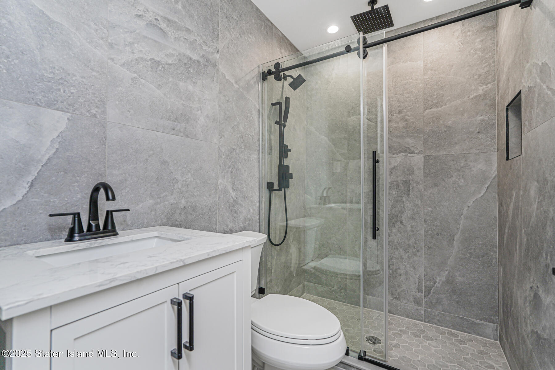 91 West Entry Road Staten Island, NY 10304 - Photo 49 of 57 a bathroom with a sink toilet and shower