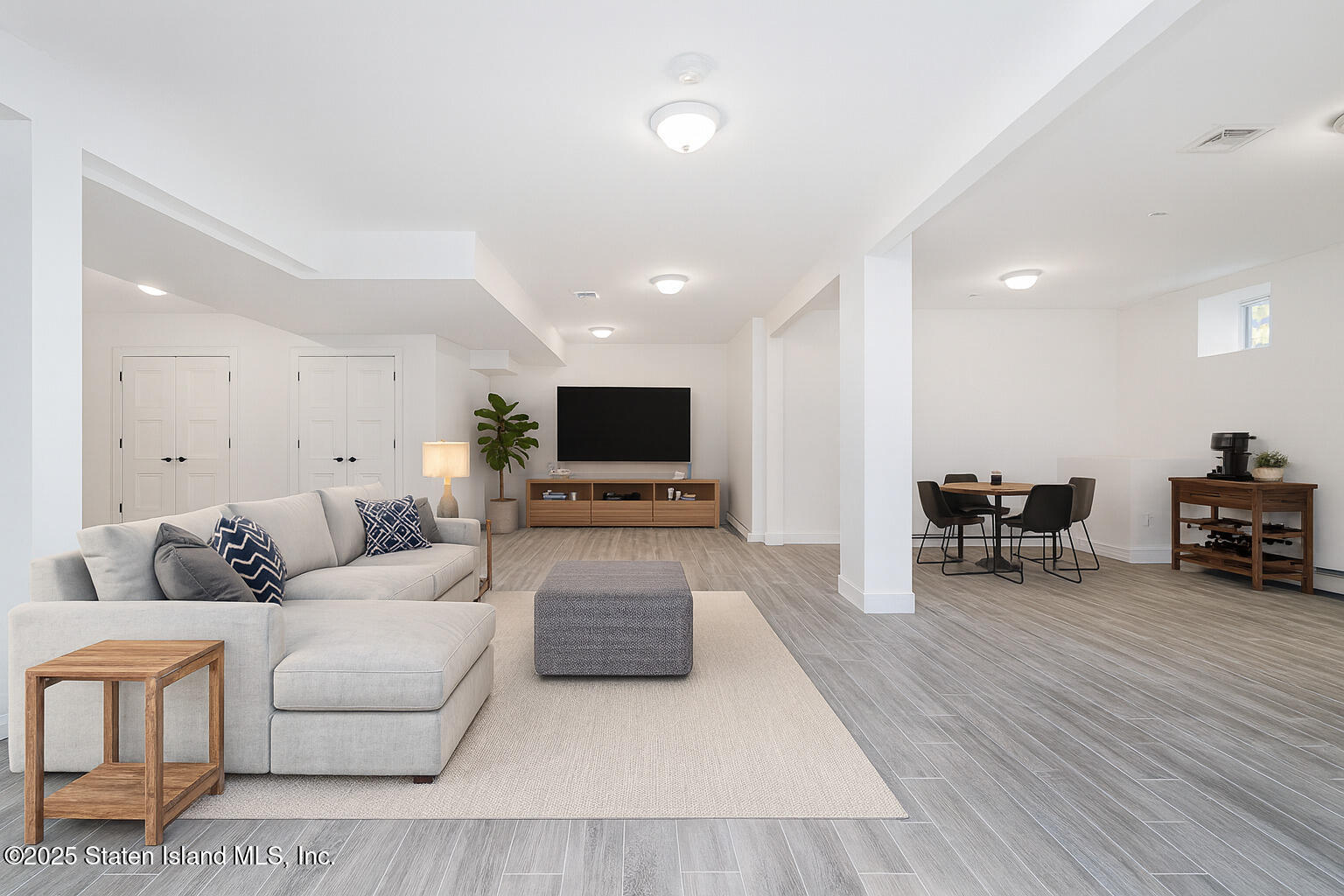 91 West Entry Road Staten Island, NY 10304 - Photo 51 of 57 a living room with furniture and a flat screen tv
