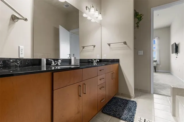 a kitchen with a sink and cabinets