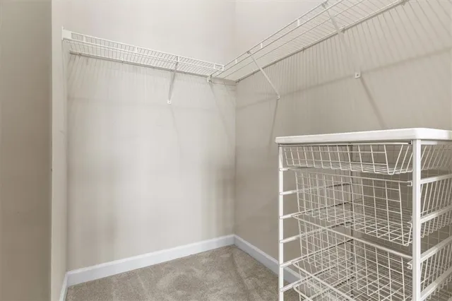 a bathroom with a shower and a glass door