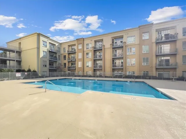 a view of a building with potted plants