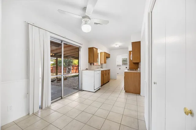 a kitchen with stainless steel appliances a refrigerator and microwave