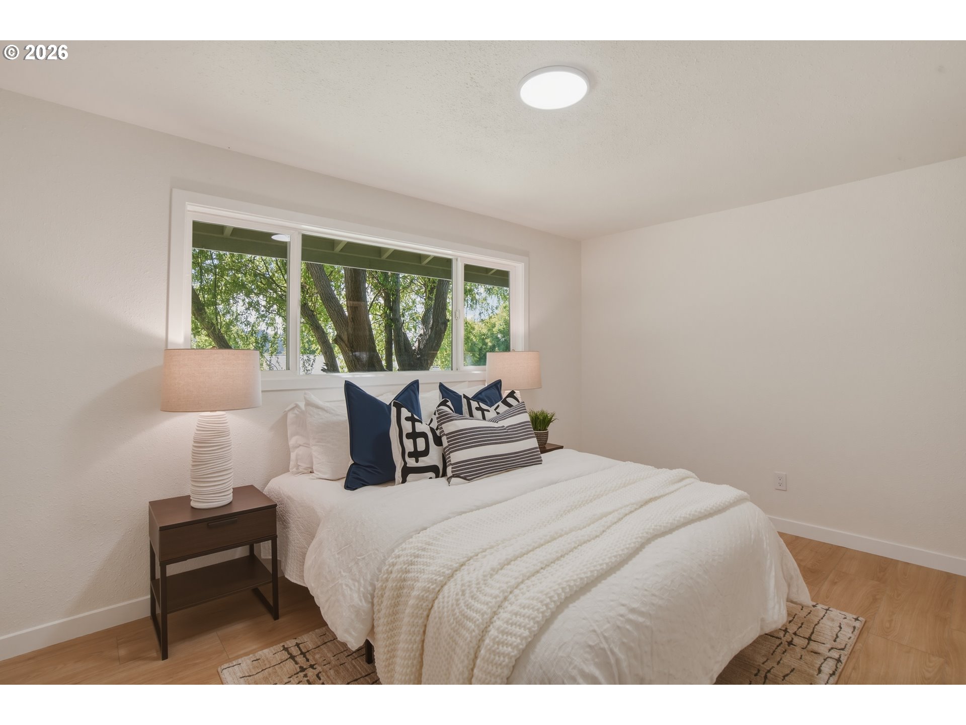 3455 Potter Street Eugene, OR 97405 - Photo 30 of 36 a bedroom with a bed and a large window