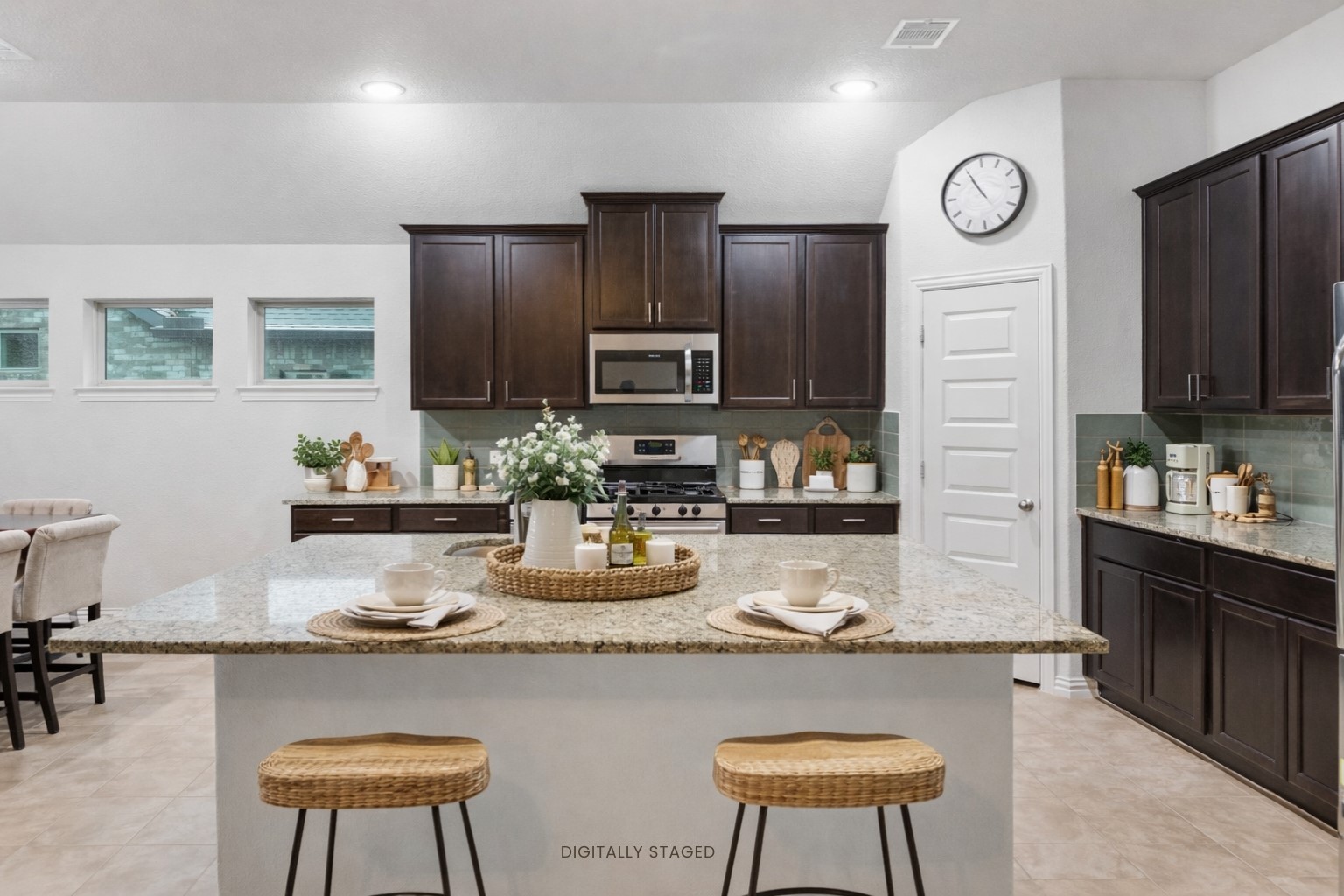 396 Nocturne Ridge Drive Willis, TX 77318 - Photo 7 of 30 Island seating and rich wood cabinetry in kitchen