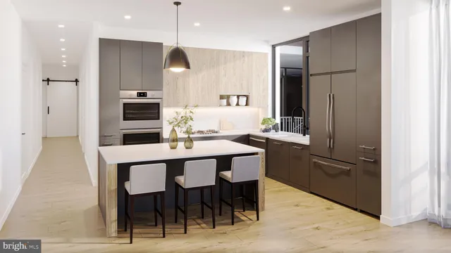 a kitchen with stainless steel appliances granite countertop a sink refrigerator and cabinets