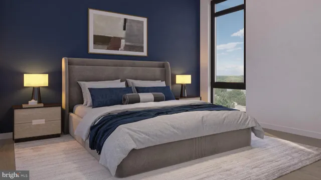 a bedroom with a bed and a lamp