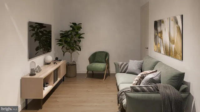 a living room with furniture and a potted plant