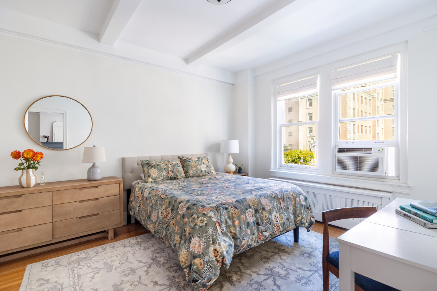 111 East 75th Street, Unit 7C Manhattan, NY 10021 - Photo 4 of 7 a bedroom with a bed and a table