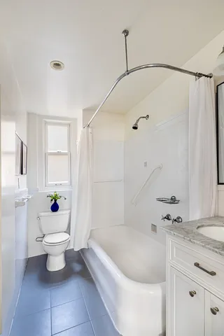 a bedroom with a bed and a table