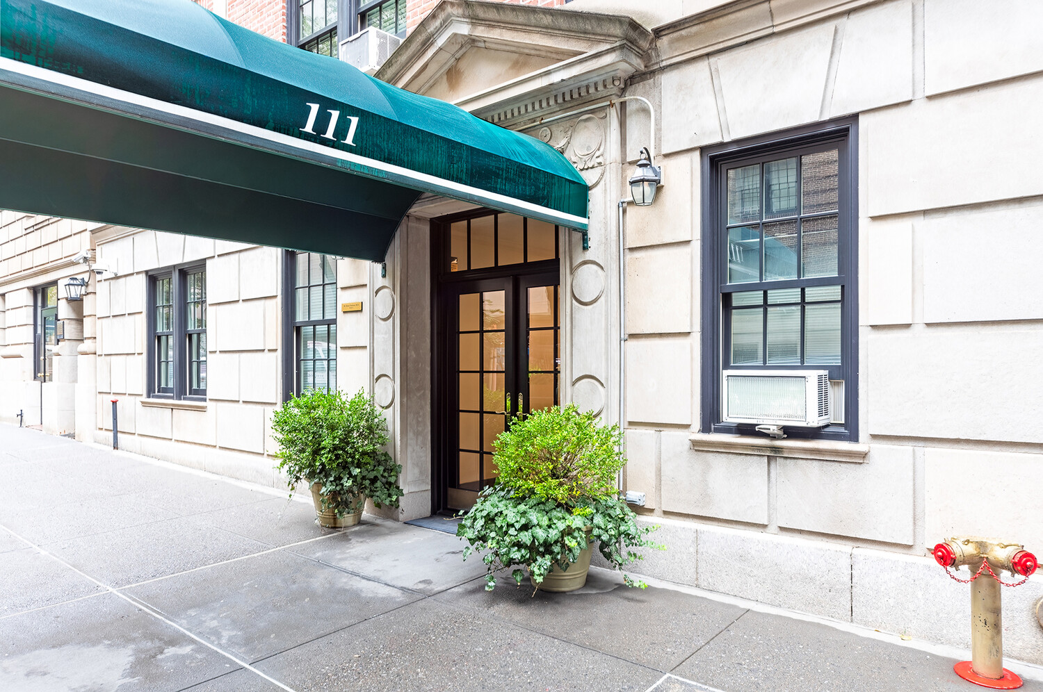 111 East 75th Street, Unit 7C Manhattan, NY 10021 - Photo 6 of 7 a potted plant sitting in front of a building