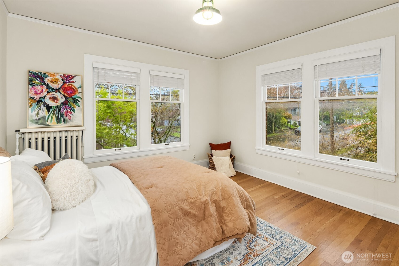 4800 Fremont Avenue North, Unit 202 Seattle, WA 98103 - Photo 12 of 30 a spacious bedroom with a bed and a large window