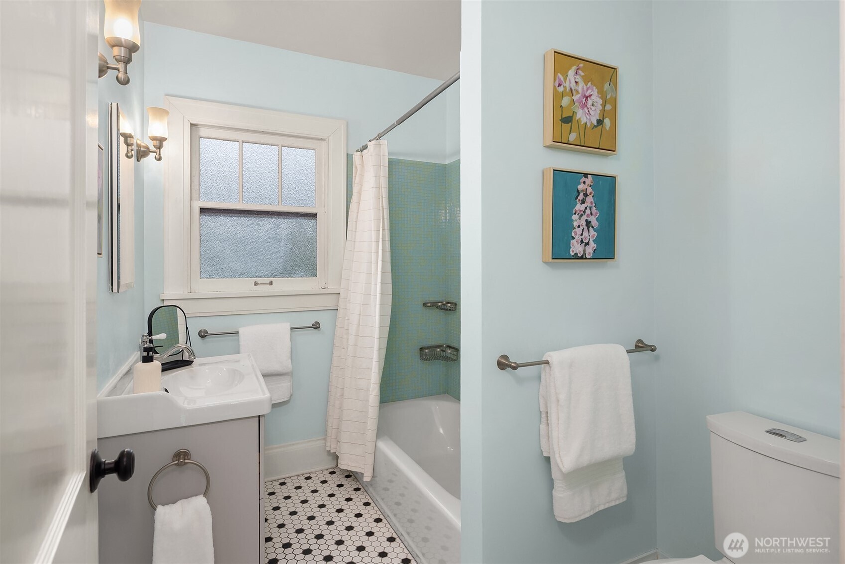 4800 Fremont Avenue North, Unit 202 Seattle, WA 98103 - Photo 15 of 30 a bathroom with a sink toilet and shower