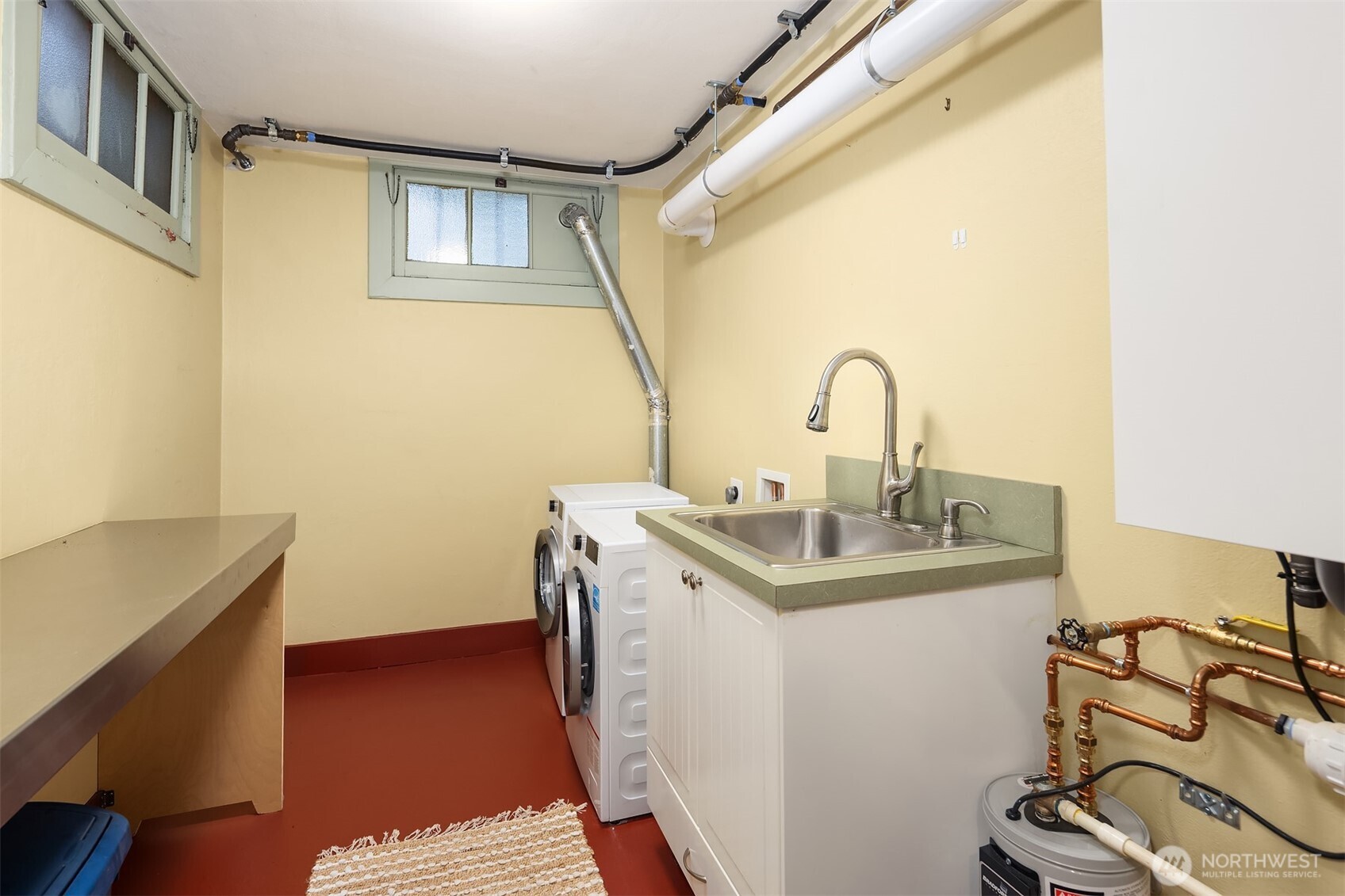 4800 Fremont Avenue North, Unit 202 Seattle, WA 98103 - Photo 19 of 30 a bathroom with a sink and a mirror
