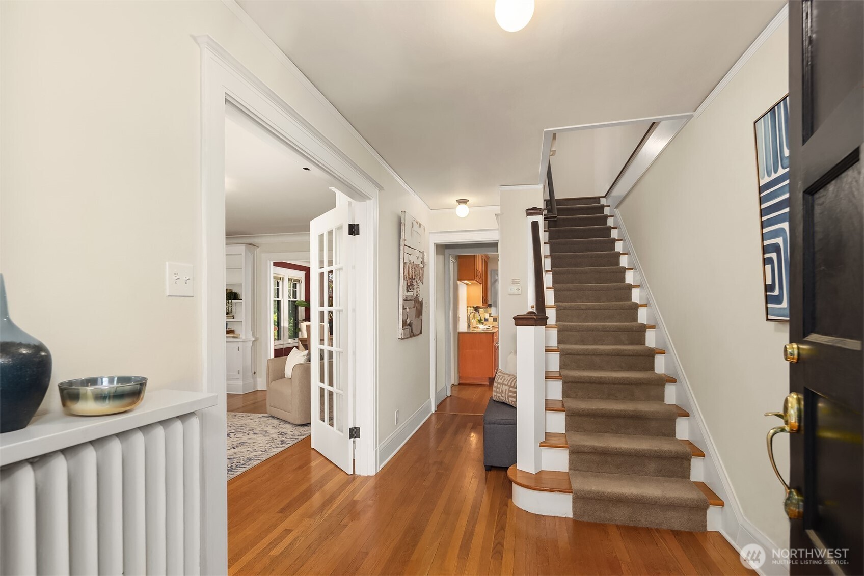 4800 Fremont Avenue North, Unit 202 Seattle, WA 98103 - Photo 2 of 30 a view of a hallway with wooden floor and entryway