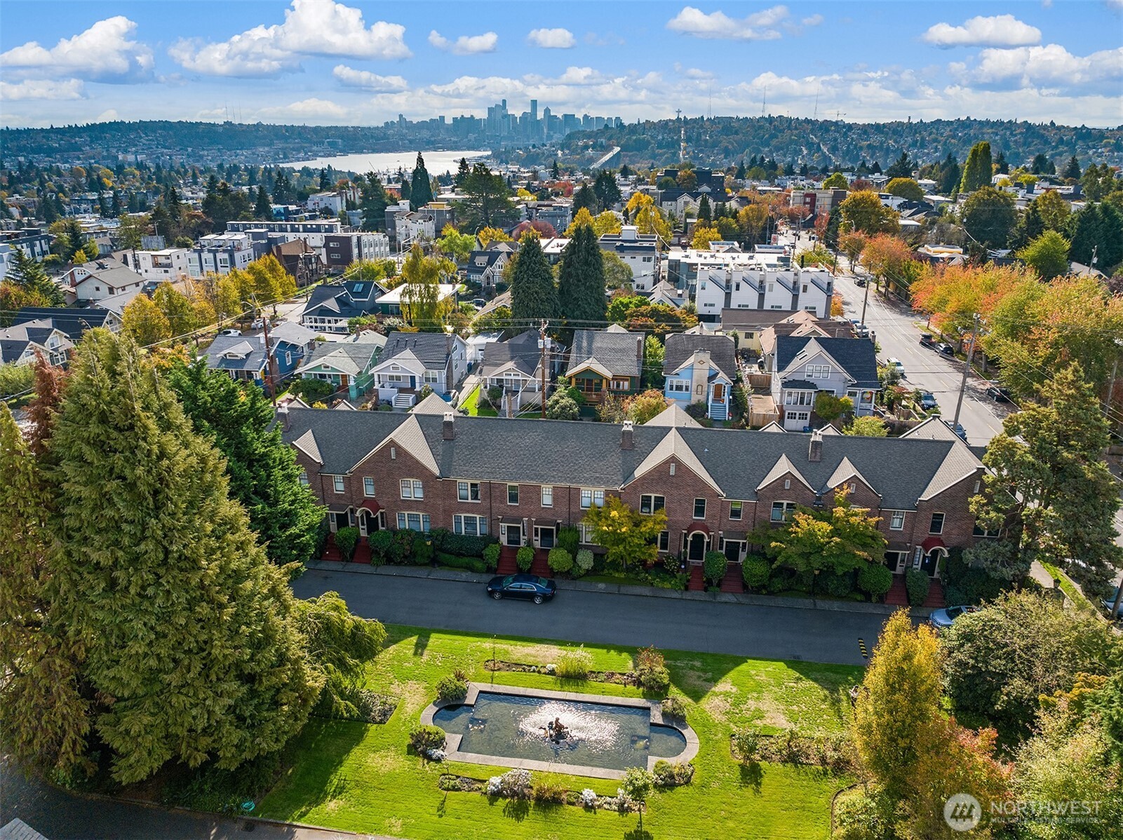 4800 Fremont Avenue North, Unit 202 Seattle, WA 98103 - Photo 29 of 30 a view of a city with swimming pool and mountains