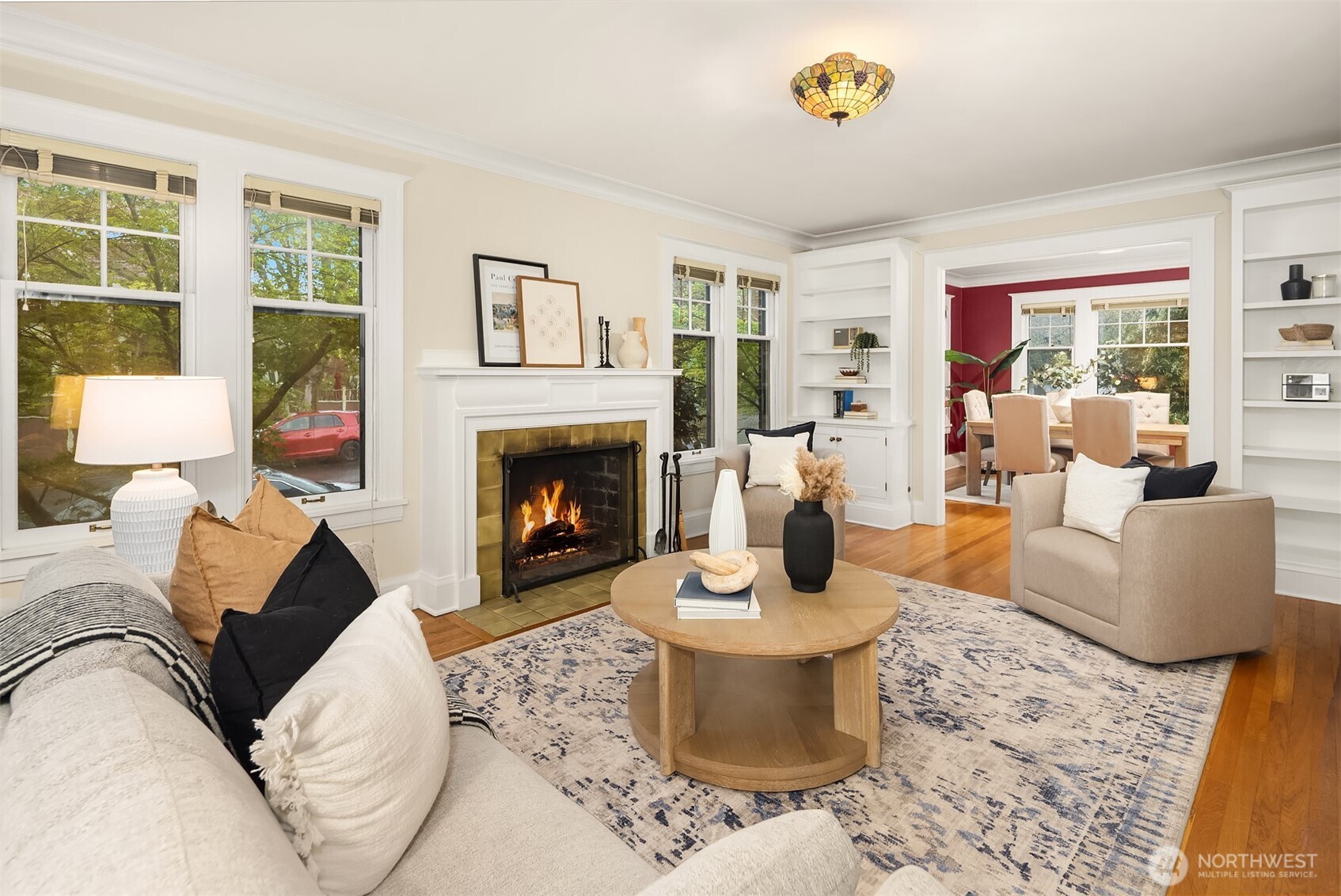 4800 Fremont Avenue North, Unit 202 Seattle, WA 98103 - Photo 3 of 30 a living room with furniture a rug and a fireplace