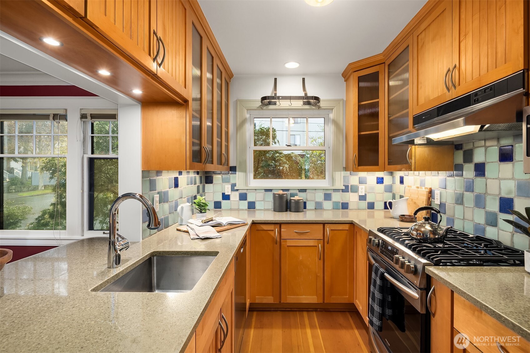 4800 Fremont Avenue North, Unit 202 Seattle, WA 98103 - Photo 8 of 30 a kitchen with a sink stove top oven and cabinets