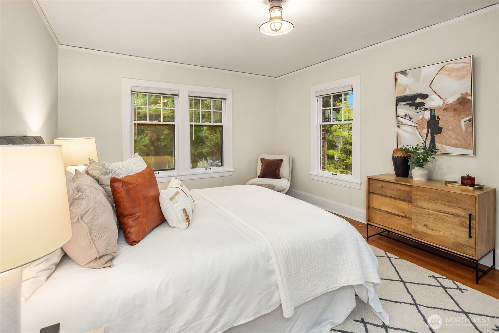 4800 Fremont Avenue North, Unit 202 Seattle, WA 98103 - Photo 10 of 30 a bedroom with a large bed and a window