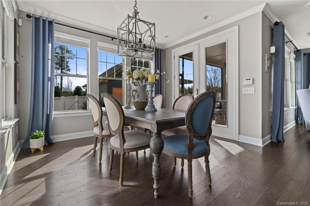 274 Helton Lane Fort Mill, SC 29708 - Photo 13 of 44 a view of a dining room with furniture wooden floor and chandelier