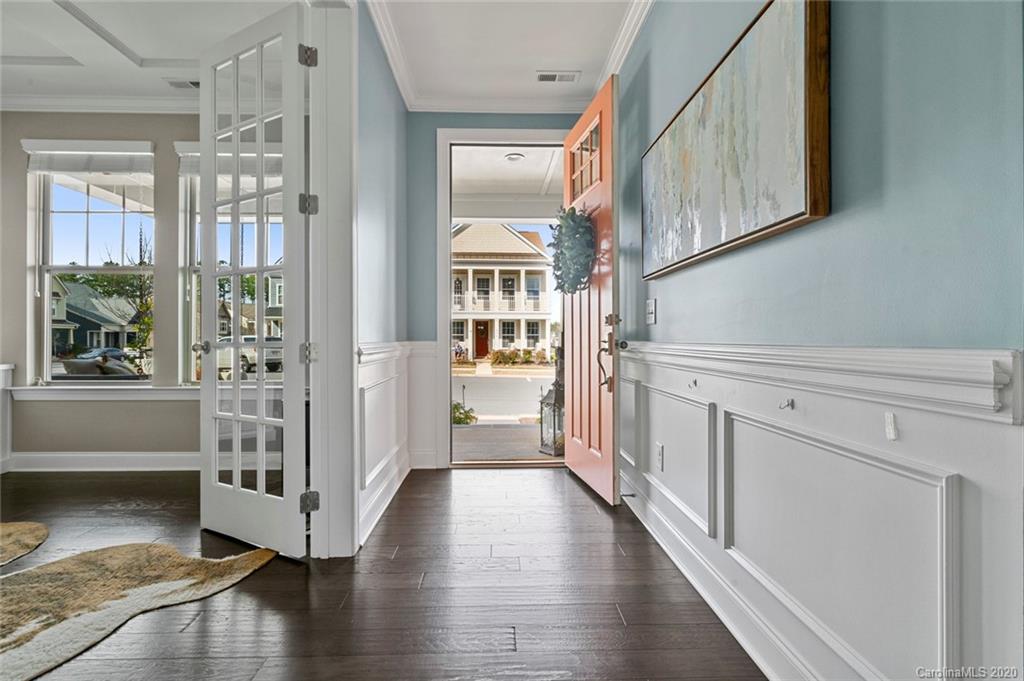 274 Helton Lane Fort Mill, SC 29708 - Photo 3 of 44 a view of a hallway with wooden floor and windows